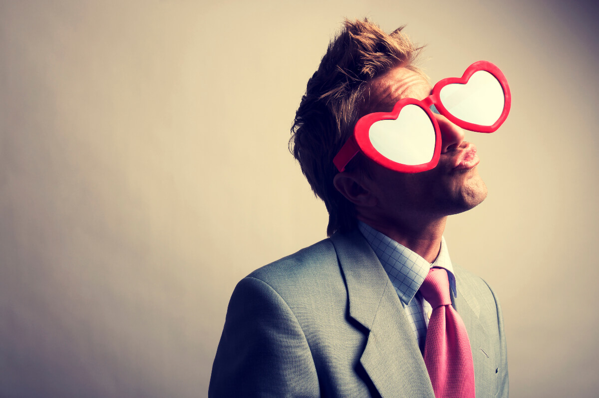 Man wearing heart shaped glasses